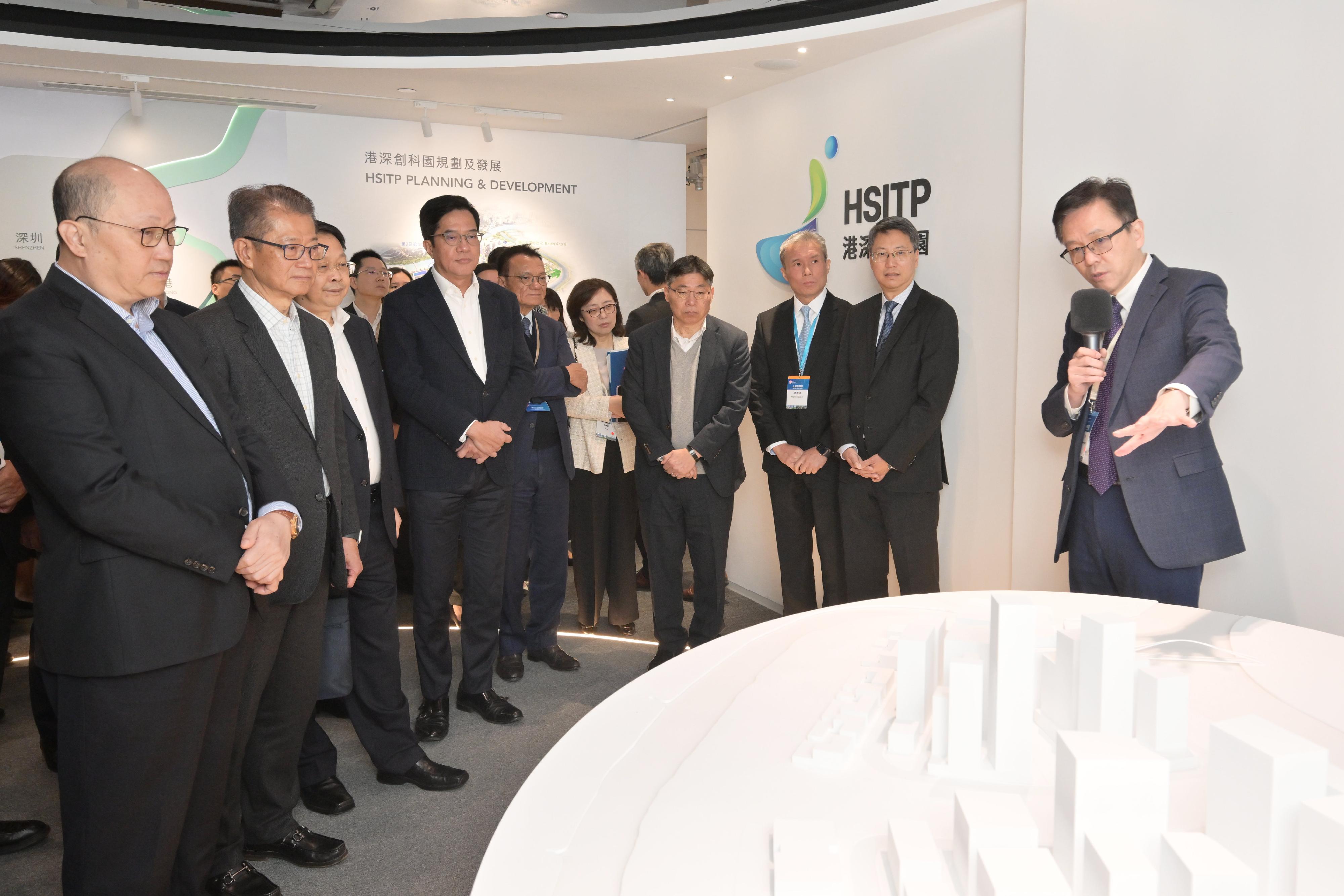 The Financial Secretary, Mr Paul Chan, led a delegation of enterprise representatives to visit the Northern Metropolis today (November 29). Photo shows the Director of the Liaison Office of the Central People's Government in the Hong Kong Special Administrative Region, Mr Zheng Yanxiong (front row, first left), Mr Chan (front row, second left), other officials and representatives of enterprises being briefed by the Secretary for Innovation, Technology and Industry, Professor Sun Dong (first right), during a visit to the Hong Kong-Shenzhen Innovation and Technology Park in Lok Ma Chau Loop.