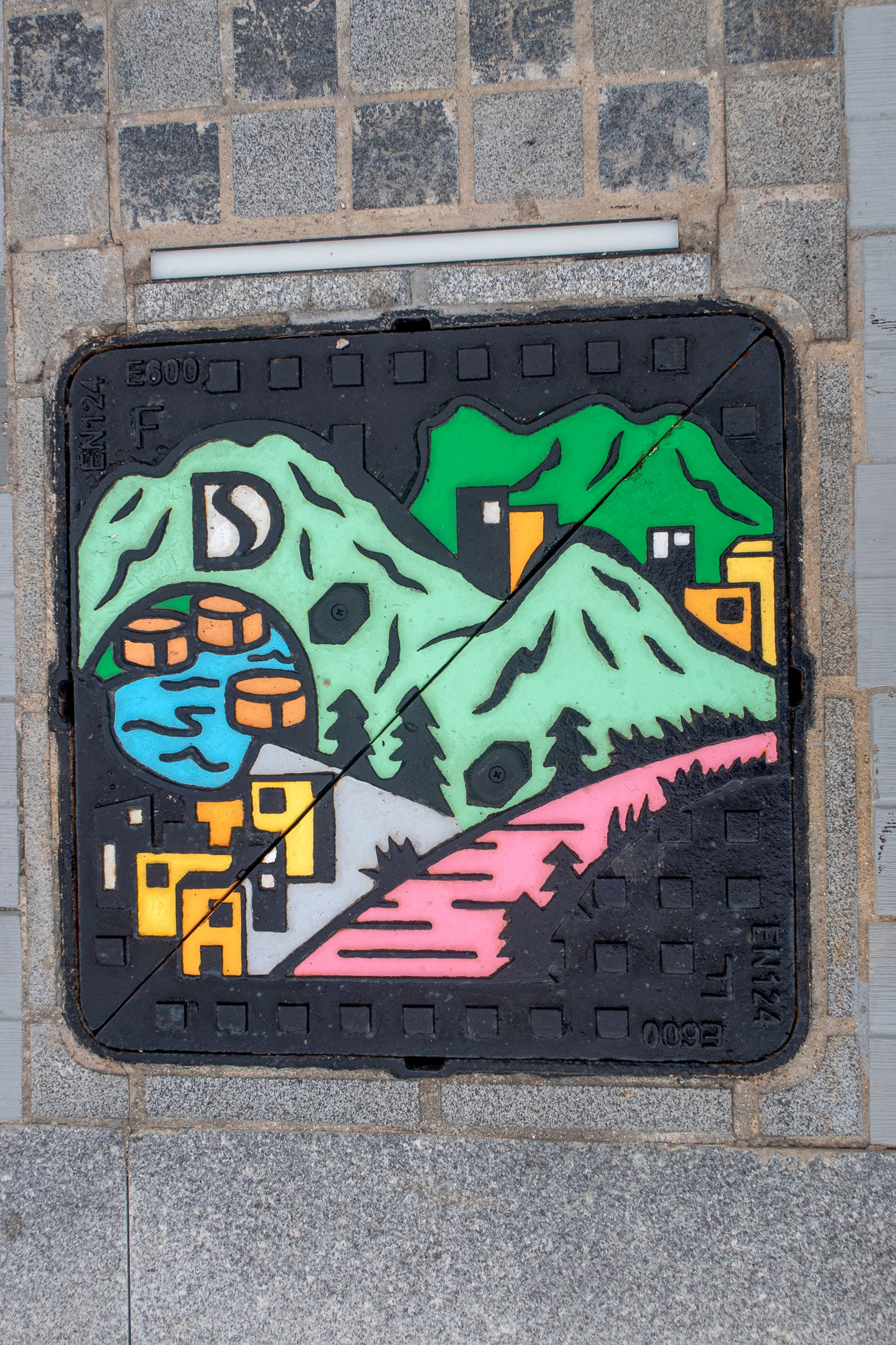Thematic manhole covers located at To Kwa Wan Promenade.